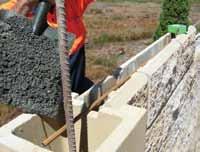 (Tile wedges can assist in keeping piers plum and level) Fill piers with concrete after every 4th course and