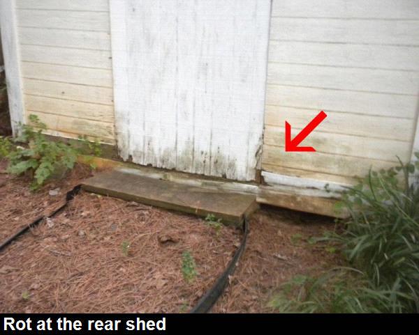 Rot was noted to the shed door and trim around the bottom of