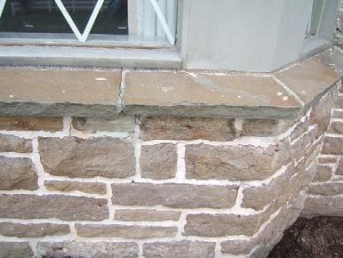2). EXTERIOR WALL SURFACES The exterior walls were noted to be brick, stone and wood surfaces.