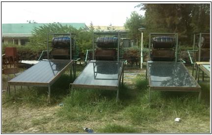 Figure 2. Flat plate solar water heaters. Figure 3. Black painted and control plastic bottles.