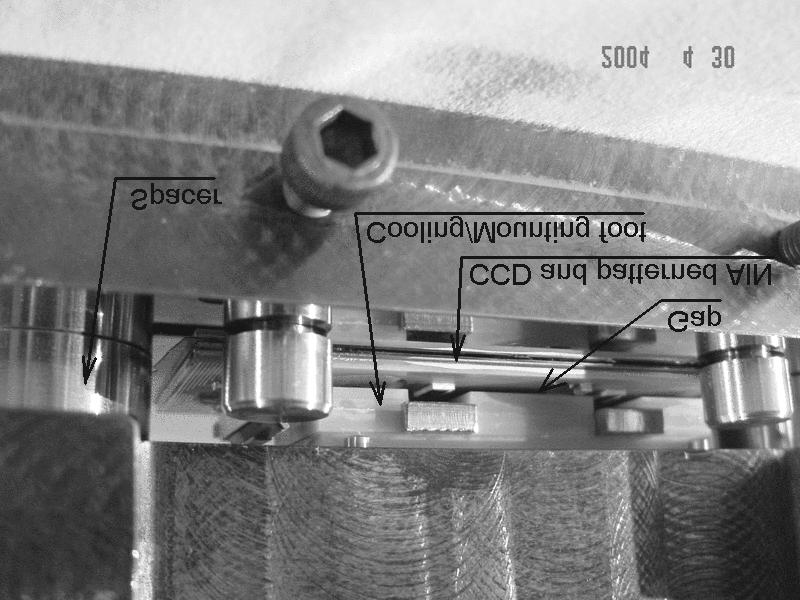 The small gap between the mounting foot and the CCD is seen more clearly in Figure 10. The spacers hold the two parts with a repeatable separation.