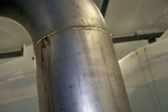 Review of the piping and literature revealed the cause could be faulty welds, chlorine or