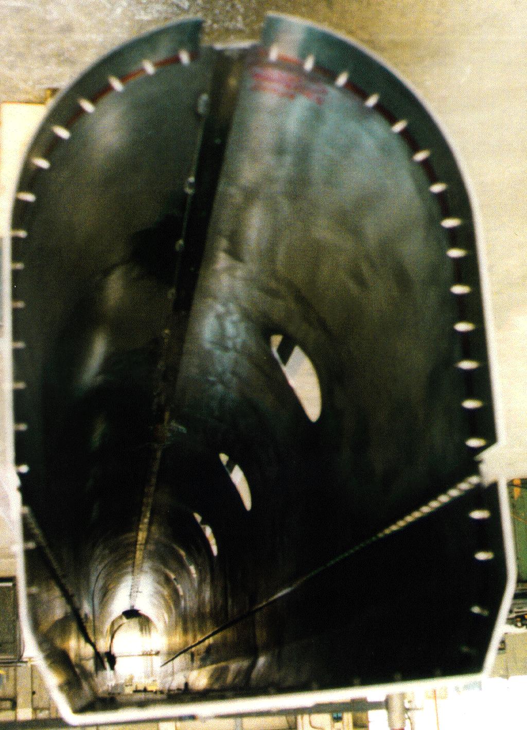 Figure 2. Left: The pre-assembled 70 K shield, showing the screws for the panel joints. Right: view of the heat conducting braids on the top part of the shield.