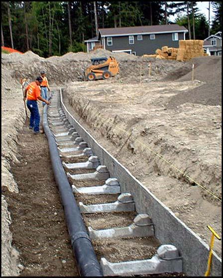 Drainage & Backfill Place drainpipe: and drainage stone (aggregate) as specified on the plans, or as approved by engineer.