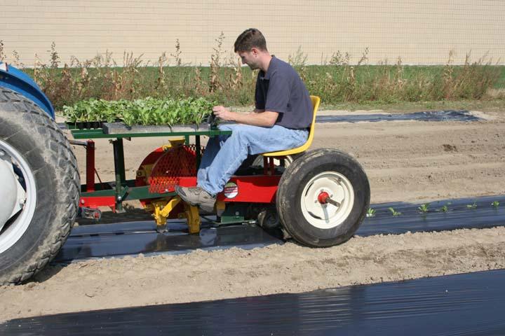 M900 CELL TRANSPLANTER This machine is used to plant cell or peat pot transplants through plastic mulch. The Model 900 can transplant cells varying in size from 2.8 to 7 cm.