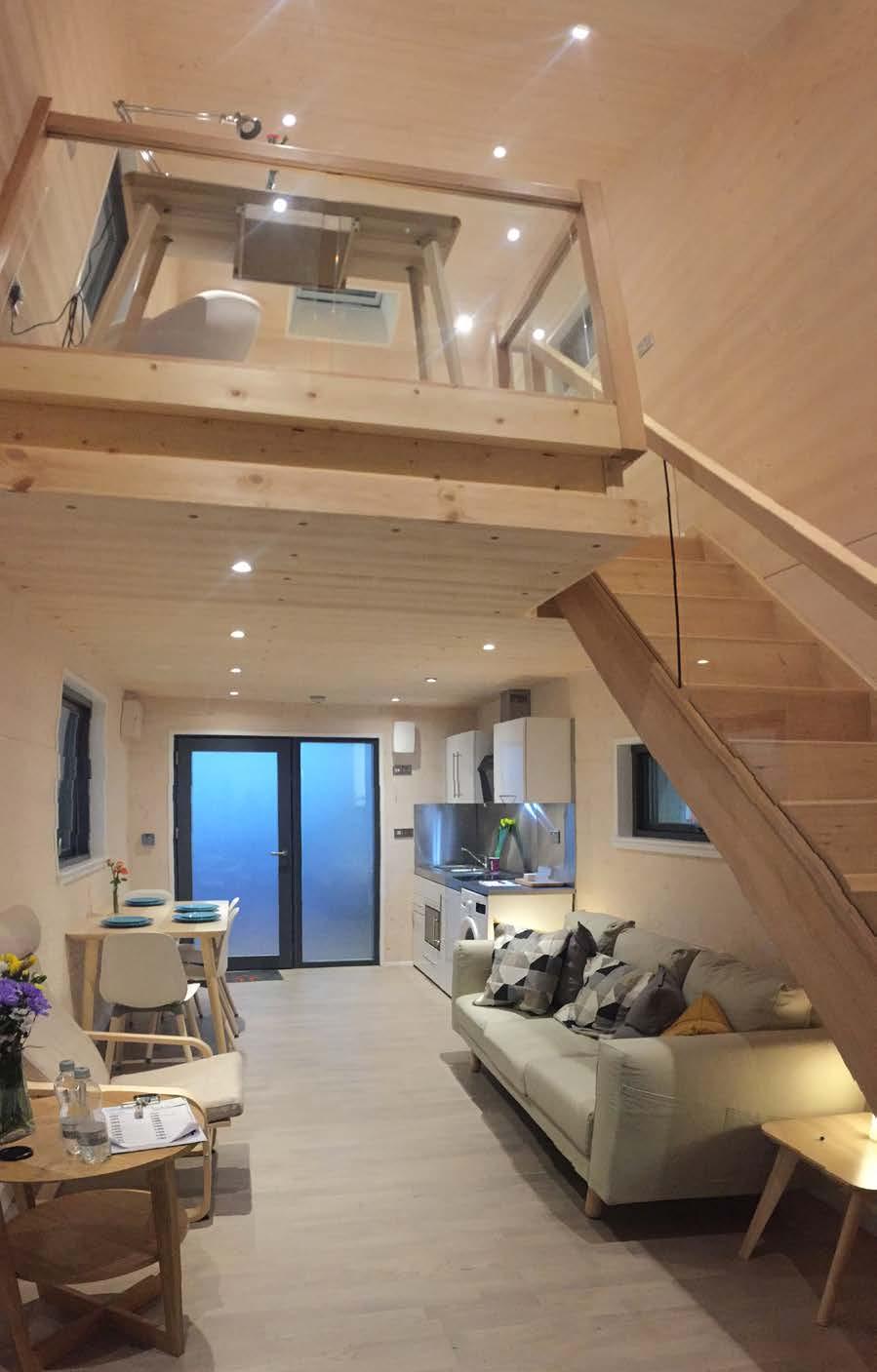 Stairs leading to a large mezzanine floor area with loft style double