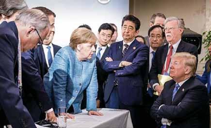 image instagrammed by bundeskanzlei At the G-7 summit, European leaders Theresa May, Emmanuel Macron, and Angela Merkel face President Donald Trump (seated). Chancellor, Mrs.