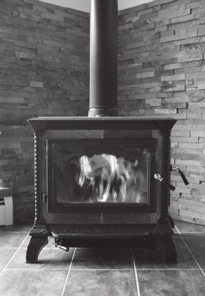 18 7 A wood burning stove is used to heat a room. The fire in the stove uses wood as a fuel. The fire heats the matt black metal case of the stove.
