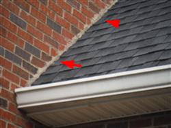 If no information is available you should consult with a licensed roofing contractor to determine how the shingles are flashed at the end walls.