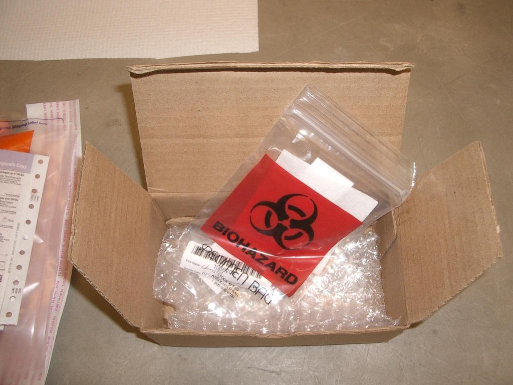 A biohazard bag with an absorbent pad and