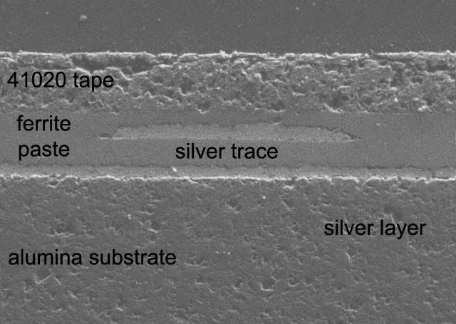100 microns Figure 4 41260-70C (K=250) Tape Buried in 41020 Tape photomicrographs that the interfaces between the various phases are void free and well defined.