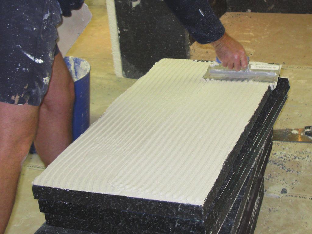 Adhesive Application 1. 100% coverage of insulation panel using a 10mm grooved tiling trowel Figure 3 - Adhesive Application 2.
