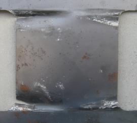 In all specimens, typical overall shear buckling and shear cracks at the center of the panel were not observed, which implies that the steel panel was effectively confined and prevented from