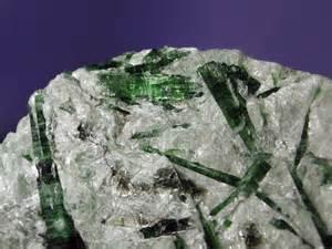 a compound. This mineral material crystallizes to form a solid.