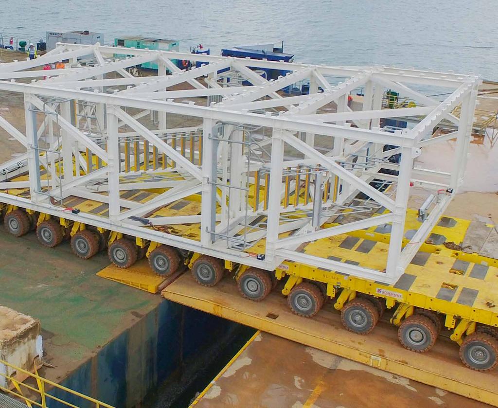 Prefabricated staircase module being rolled onto vessel Two 650 MT gas compression modules Following the successful shipping and delivery of the 220-metric-ton E-Room package and, once again,