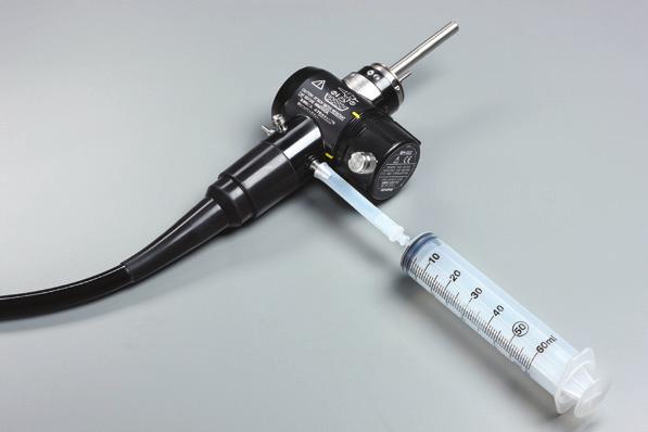 cc of sterile water from the water container. 4. Attach the syringe to the S/B connector on the light guide end on the universal cord. Make sure the instrument port is capped to avoid sample leakage.