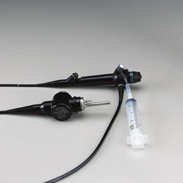 Attach the suction/biopsy connector to the end of the barb hose located on the single use suction valve. (Figure 2) 2. Fill a 60 cc syringe with air. 3.