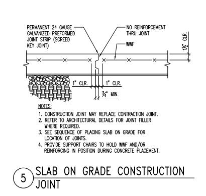 The slab reinforcement stops at construction joints as shown in the details below. Found on page S4.01 of docs.