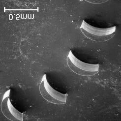 Fig. 6 (Left) shows a herring-bone air bearing pattern fabricated with SU-8 50 photoresist (PR). The replication of the pattern is very good up to a depth of 1mm.