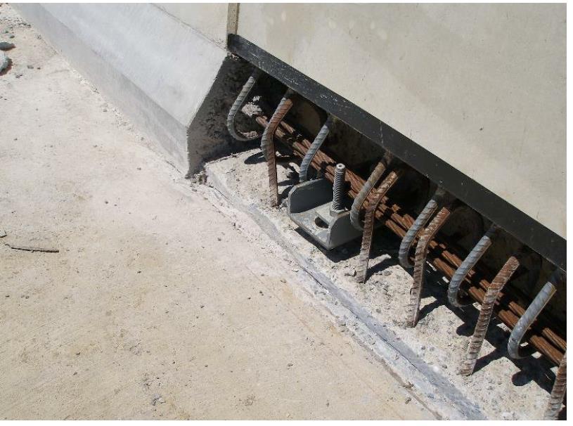 Figure 6: Longitudinal kerb-stitch and steel levelling bracket for precast barrier unit for AS51000/2004 All of these effects will impact on the costs of constructing bridges which will put