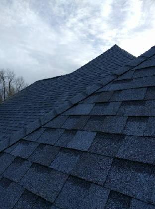 Acceptable Material: Asphalt shingle - The roof was found in good condition. 3. Type: Hip 4. Approximate Age: 1-3 years 5. Acceptable Flashing: Aluminum 6. Acceptable Skylights: Insulated glass 7.