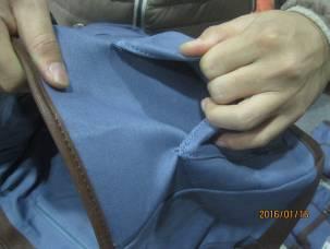 bottom)-1,make sure all metal parts are correctly attached/stitched to the fabric of the bag.