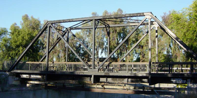 Figure 1: This railroad bridge is one example of a truss structure. then all the bridge components must be in equilibrium and the forces must sum to zero.
