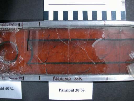 Paraloid B72 is adhesive and brittle.
