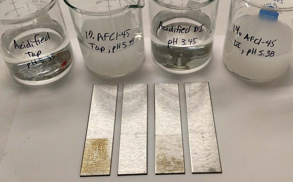 Water Soluble Corrosion Inhibitor Corrosion Testing: Flash Rust Protection at ph ~3 to ~5.5 DeCORE AFCI-45 @ 1% by weight (0.45% active) First Beaker: Acidified tap water (ph 7.