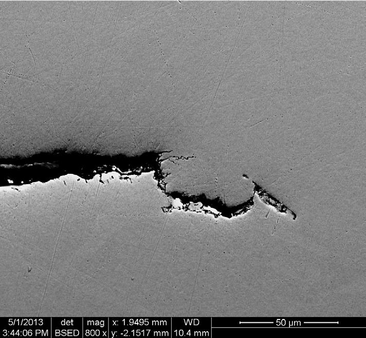 Figure 3-28. SEM micrographs of cross-section through WOL specimen 2 (near support cage). 3.3 Canister wall specimens Two specimens measuring approximately 1 cm square were cut from about half way up the height of the canister (Figure 3-29) at approximately 120 angular separation.