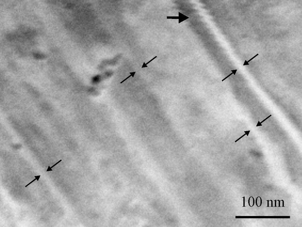 Fig. 3.4 Imprinted BMG using die made with 50 nm zirconia powder. On each of the imprinted BMG surfaces, linear features corresponding to the direction of the scratch marks on the dies were located.