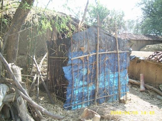 Temporary superstructure arrangement for the toilet at Mongra GP in Chhattisgarh A boys stands near his non functional toilet at Mongra GP in Chhattisgarh Water storage outside the toilet is the most
