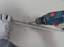 Measure and mark the required ceiling height, then fix the CasoLine quick-lock grid WA0 Wall Angle or WA0 Wall Angle around the