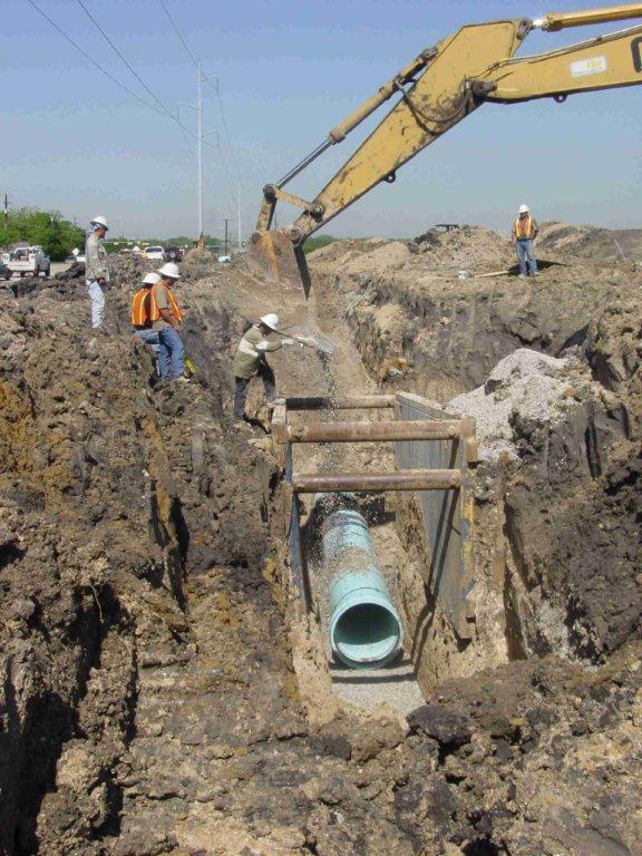 INITIAL BACKFILL: The material placed over the crown of the pipe to a height of 6 to 12 inches is the initial backfill.