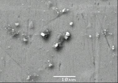 Fig. 2. Left: A356 Al alloy Right: A356 Al/KFA 10% wt. composite. Fig. 3. Left: Fine FA particles clusters within A356 Al/KFA 10% wt. composite. Right: Hole along particle cluster on the surface of the A356 Al/MFA 10% wt.