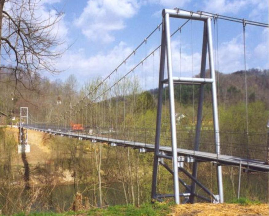 3.2 Swinging Bridge A pedestrian swinging bridge that is 128 m long and 0.92 m wide was constructed in April 1999 over the Big Sandy River in Johnson County, Kentucky (Fig. 4).