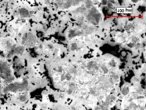 The microstructure is typical for this type of formulation, specifically a heterogeneous microstructure constituted of areas with divorced pearlite, fine pearlite/bainite,