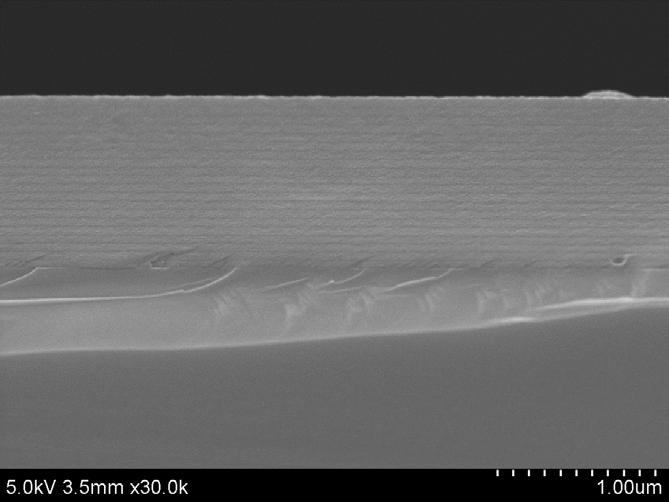 Figure 4: Amorphous SiN with distinctive interlayer zones Further development led to achieving a dense, amorphous SiN film. Figure 5 shows an SEM image of this film.