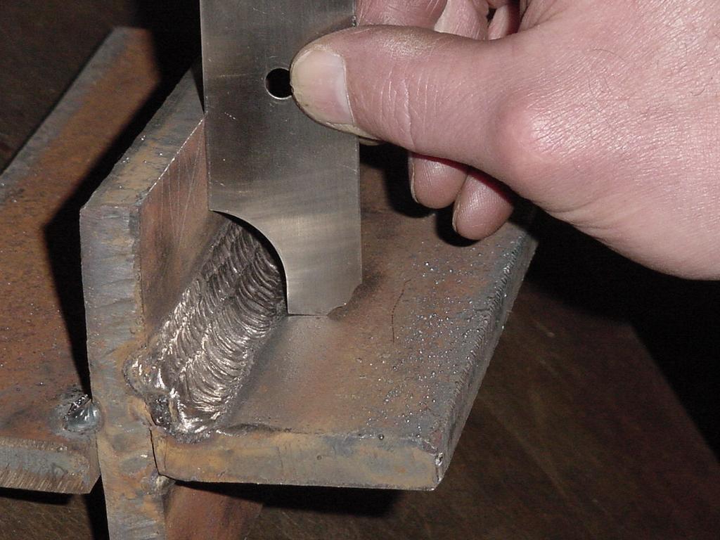 The weld equals the size of the gage. Rotate the gage to measure the other leg size. Note: In this picture, the weld is not large enough.