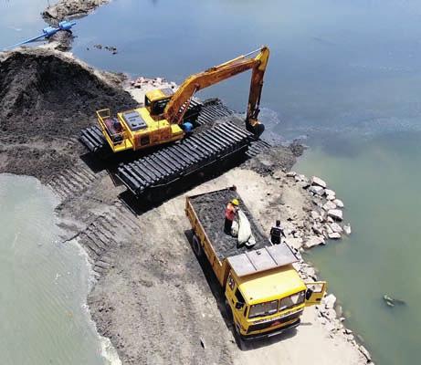THE BARGE TO SHORE Suction dredging is more efficient than excavating because you do not need to handle the same material many times with many different machines.