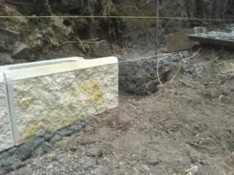 Footing poured - vertical steel rods and steps showing This footing was excavated to 400mm wide x 300mm deep.