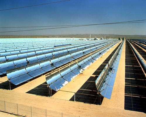 Concentrating Solar Power (CSP) Parabolic trough mirrors concentrate the solar energy to heat oil. The heated oil produces steam in a heat exchanger to drive a turbine.