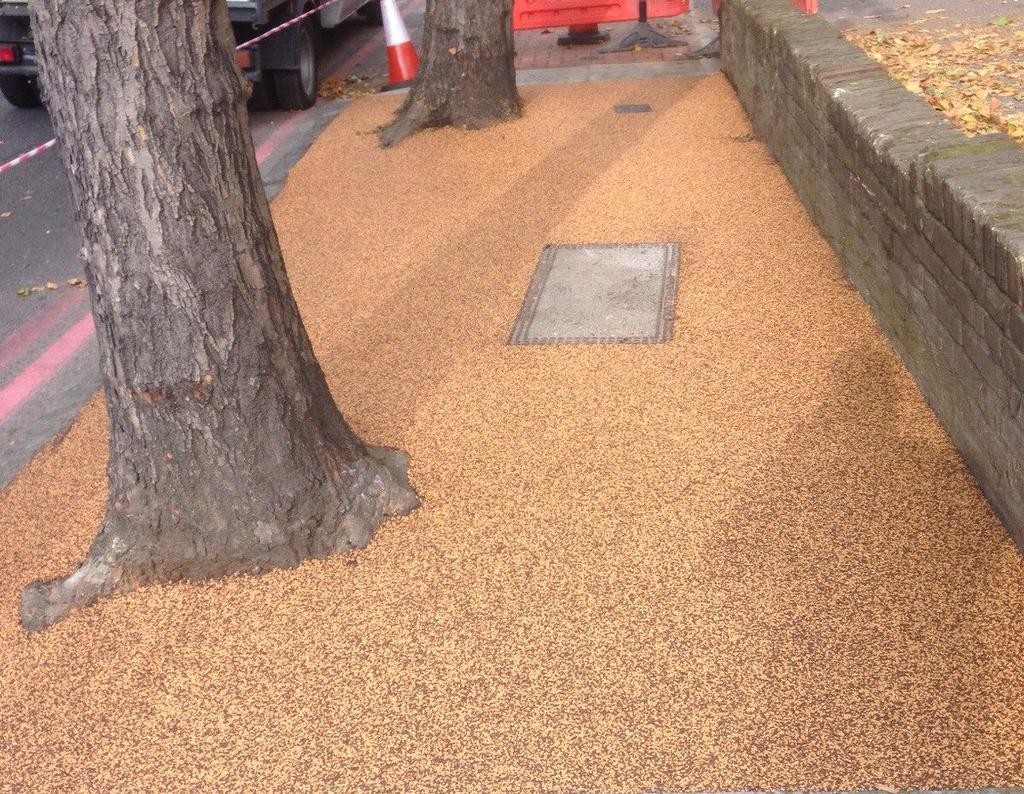 FEATURES SuDS compliant highly permeable UV stable non yellowing resin includes recycled rubber granules alternative to tree grilles installed by approved contractors