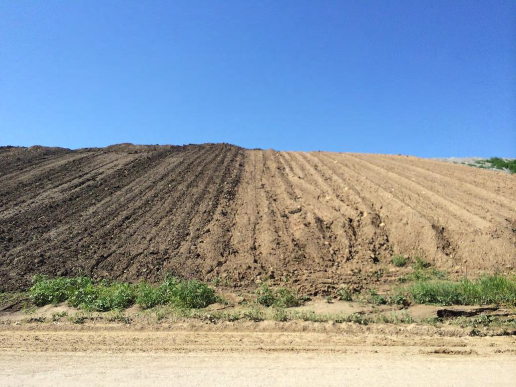 Farmland topsoil on left; tan overburden