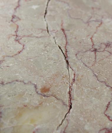 If etching is a concern, select a material with a Minimally Sensitive acid resistance rating, such as a quartzite.