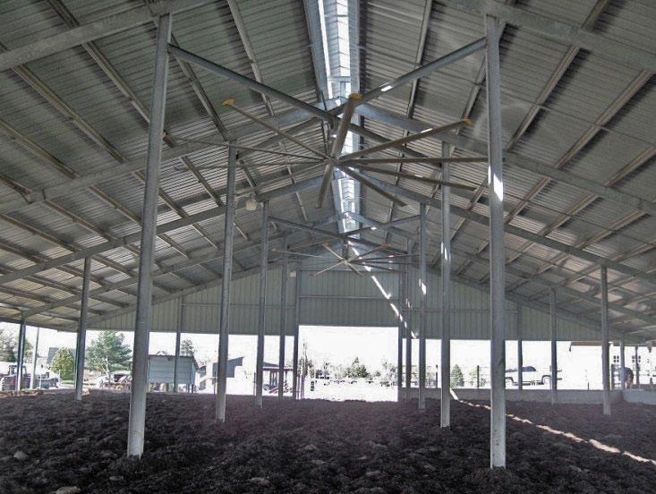 Figure 42. High volume, low speed fans have been added to many compost bedded pack barns. These fans distribute air well across a wide area.