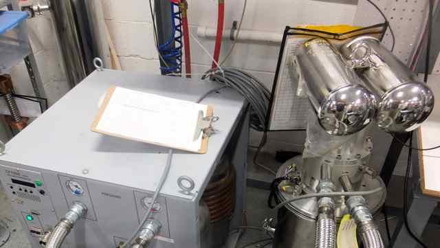 shine between the first stage and shield and the second stage. Figure 5. The PT415 cooler test setup at Cryomech. The compressor is on the left.