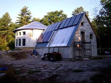 The more common situation, however, is one with solar panels on top and water tank below. (http://flanaganandsun.
