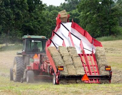 The Kuhns Hay Accumulator system uses gravity and a simple mechanical system to efficiently arrange the bales into a group that is then left in the field.