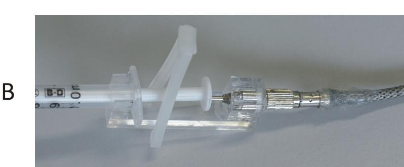 Figure 2B. The assembled device. Using the device 1. Release the cable by pressing the hold rim. 2. Fill the desired dose (not more than 100 l) in a 1 ml syringe and cap the needle. 3.